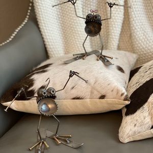 Small metal skier sculptures